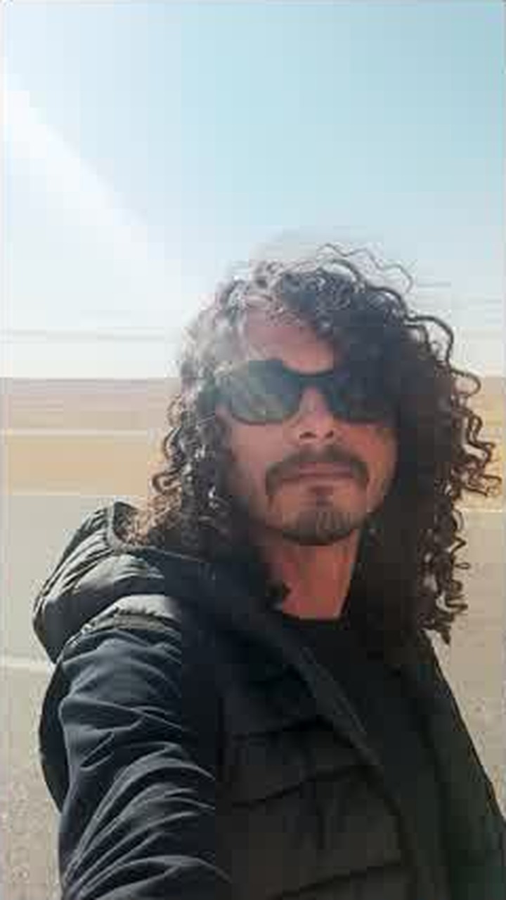 Asaad on the road, portrait against the coast