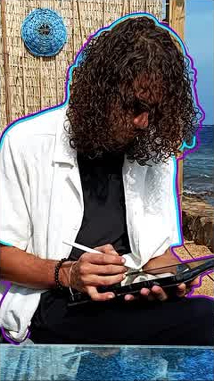 The reveal frame: Asaad outlined in animated colour, the Video Editor