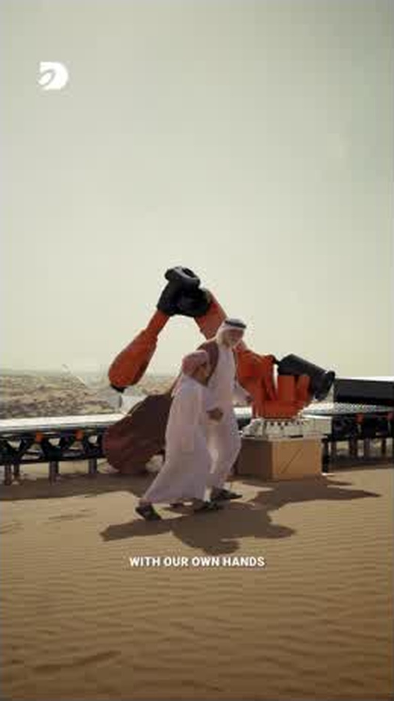 Industrial robotics at human scale, integrated into the live-action desert