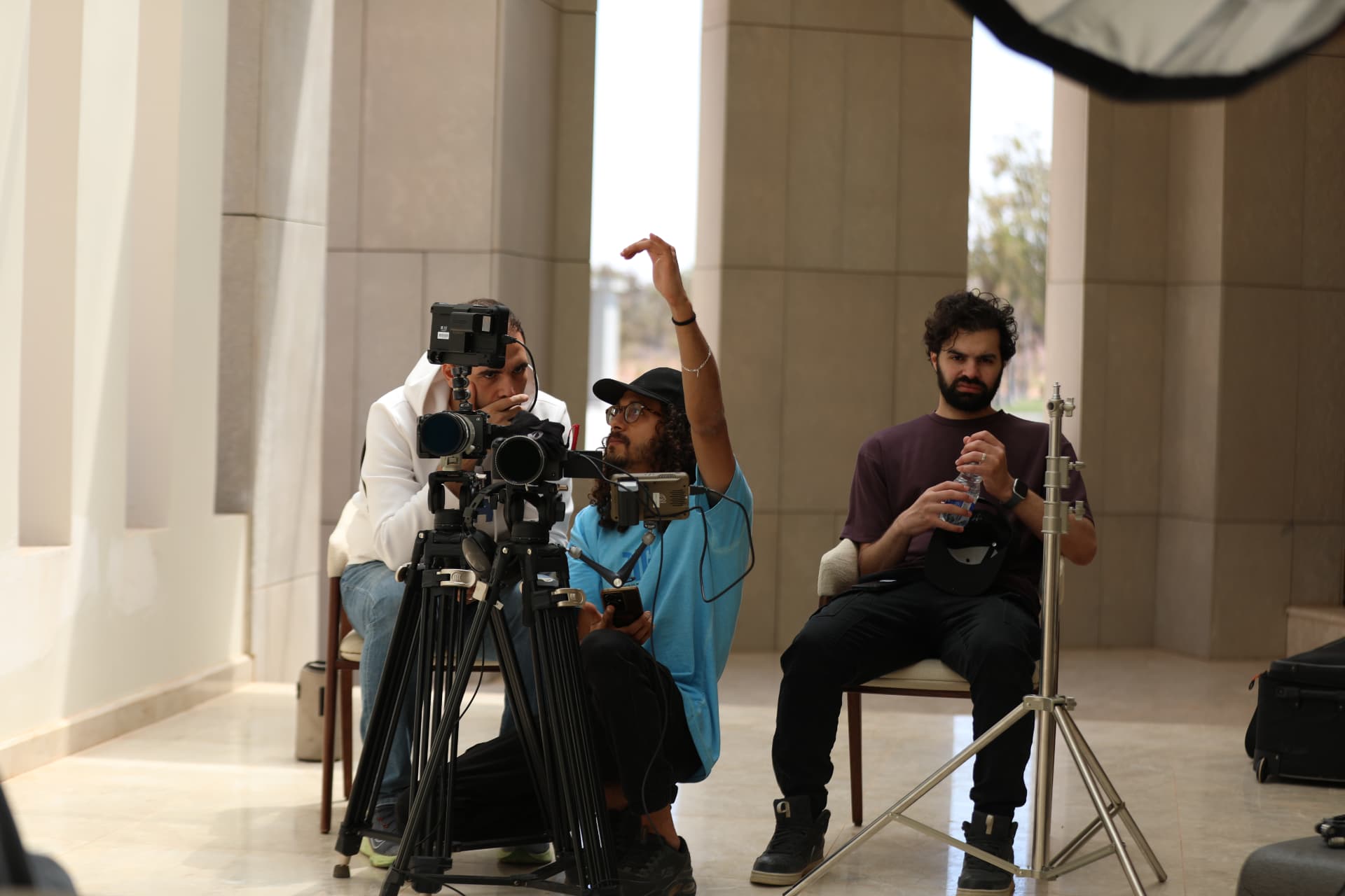 Asaad working behind the cameras with the production team in Derna
